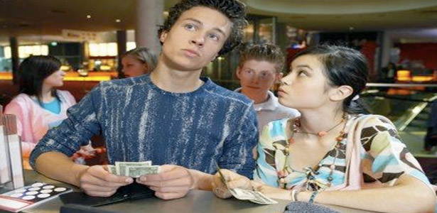 couple at movies deciding who should pay for date